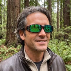 Image of man in forest wearing Cocoons fitover sunglasses model C427R